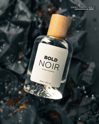Bold Noir for Him men's fragrance bottle with sleek black design and minimalist label, showcasing elegant branding.